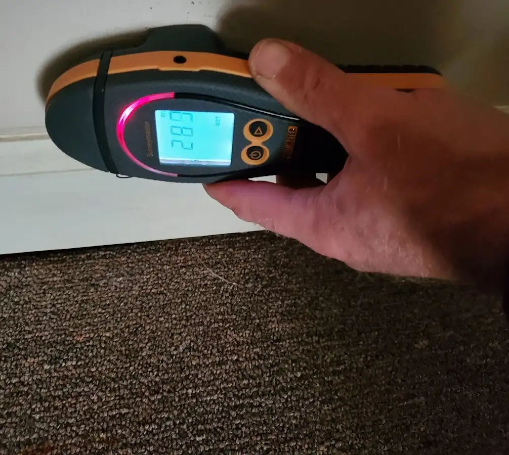 Moisture detection at baseboard during Storm Damage Restoration in Saratoga
